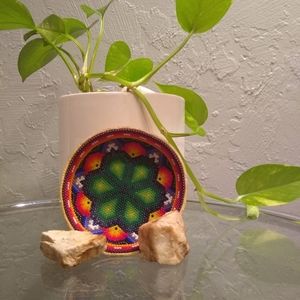This is a wooden bowl with beads